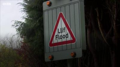 Flooding road sign