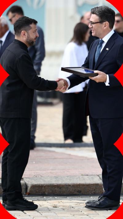Ukrainian President Volodymyr Zelensky shaking hands with UK Prime Minister Andy Burnham.