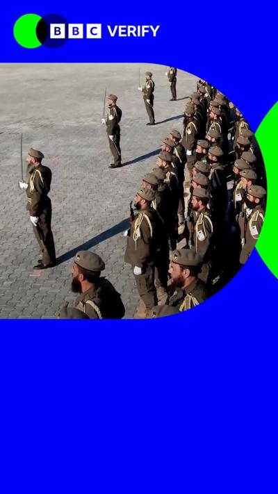 A promo image showing troops parading at the rebel training camp in Syria