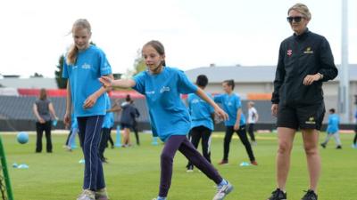 Former England captain Charlotte Edwards coaching some girls