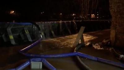 Water over tops flood defence barriers