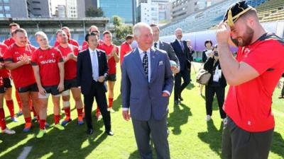 Prince Charles meets Owen Lane to give him his World Cup cap