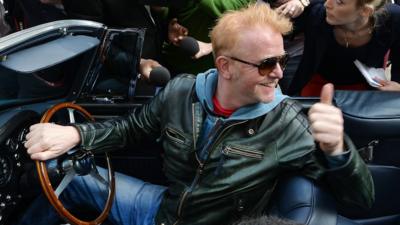 Chris Evans leaves the BBC Radio studios in London, in his vintage Aston Martin, after he was announced as the new Top Gear presenter.