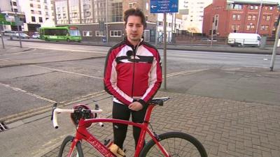 Cyclist outside BBC Nottingham