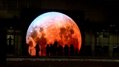 Illuminated moon art installation