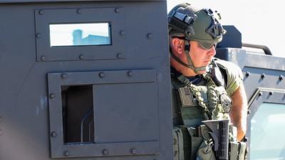 An armed police officer at the scene of the California mass shooting