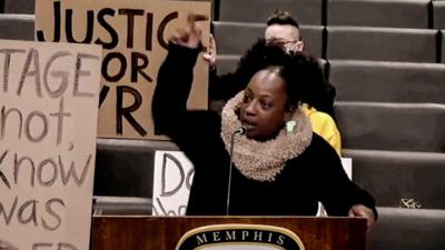 Woman speaks at a podium