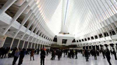 New Yorkers and tourists get their first look inside the cathedral-like hall that sits atop the new $4 billion train station at the World Trade Center