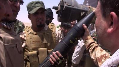 Shia militia fighters in Baghdad show off weapons they say were bought from Iran