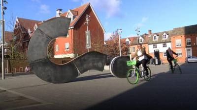 People on the bikes near the University of Suffolk