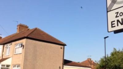 Plane flying over a house in Francis Road, Hounslow