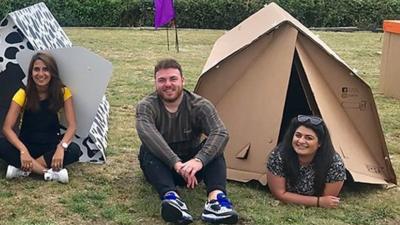 People in cardboard tents