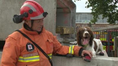 Fire service dog handler Graham Currie with Kirby