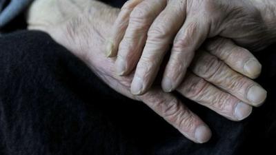 Hands of an elderly man