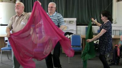 People learning Indian dance in hospital