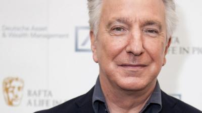 Actor Alan Rickman poses for photographers on arrival at "BAFTA A Life In Pictures, with Alan Rickman" in central London, April 15, 2015.