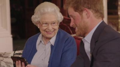 The Queen and Prince Harry smiling