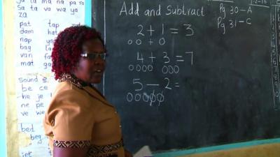 A teacher in a school in Uganda