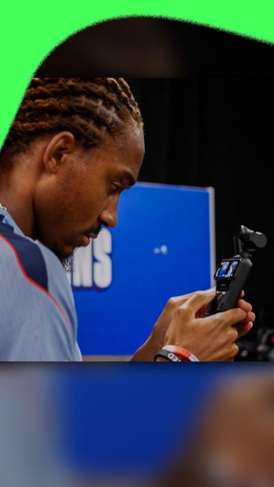Djed Spence with a video camera