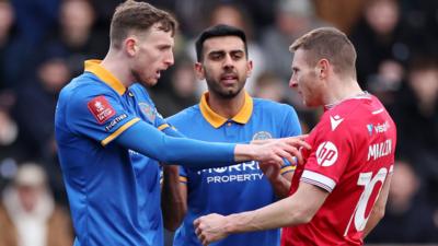 Joe Anderson of Shrewsbury Town (L) clashes with Paul Mullin of Wrexham during their FA Cup Third Round tie in January