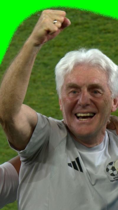 Hugo Broos celebrating at full time  