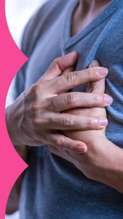 Stock image showing a person clutching their chest 