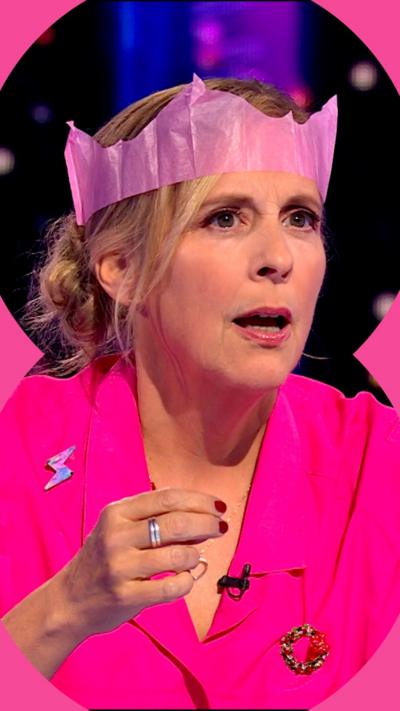Blonde woman wearing pink and a matching Christmas cracker crown