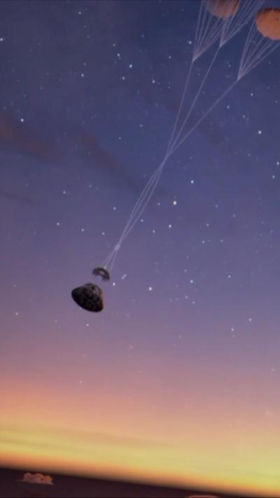 A CGI creation of what the Artemis II return may look like. A capsule is being supported by parachutes