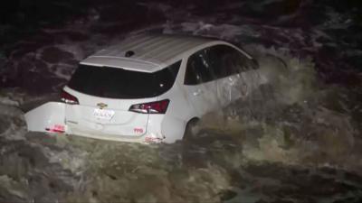 White LADF vehicle in ocean at night