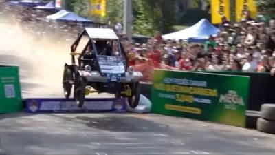 Soapbox car in air after jumping a ramp