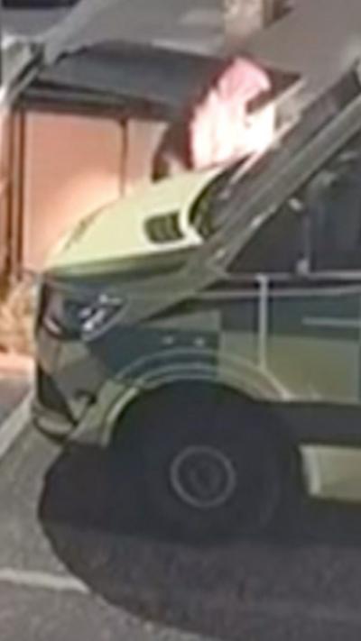 CCTV screenshot of suspect near ambulance