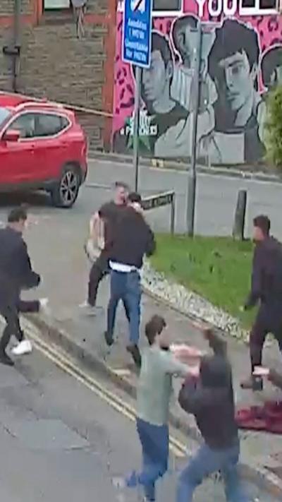 Men seen fighting in the street