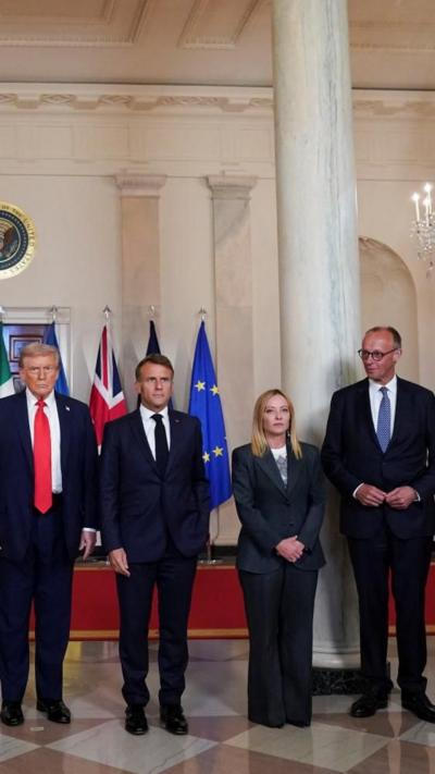 Trump, Macron, Meloni and Merz stand next to each other in the White House