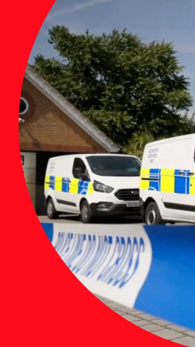 Police forensic vans behind crime scene tape at a residential property
