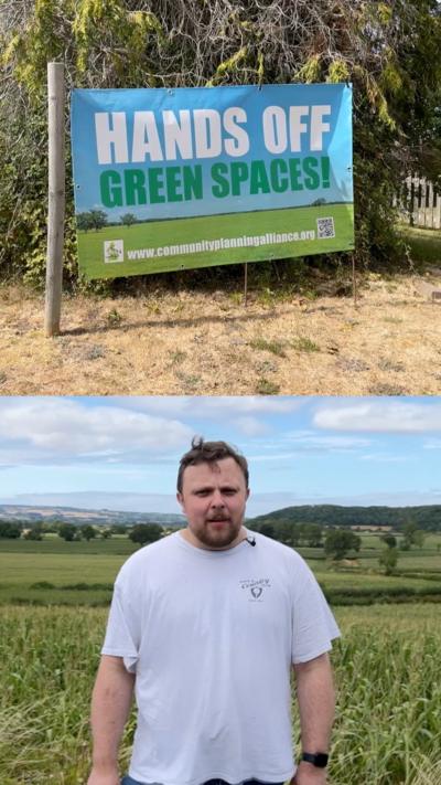 A split image, with the top image showing a poster which reads 'hands off green spaces' and the bottom image showing a man with dark hair and a beard in a white t-shirt standing in front of rolling hills and fields 