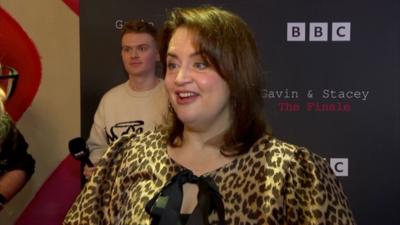 Ruth Jones wearing a leopard print jacket