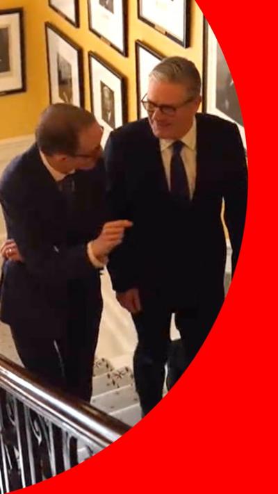 Chris Mason and Sir Keir Starmer walking up the Downing Street stairs