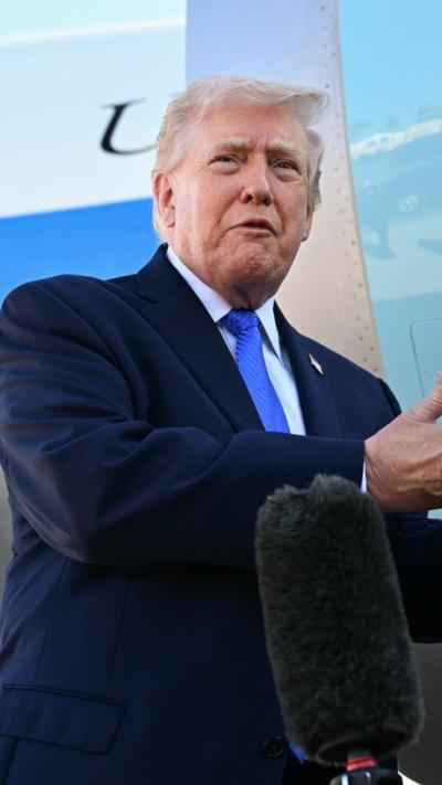 Trump speaks to the press in front of Air Force One. 