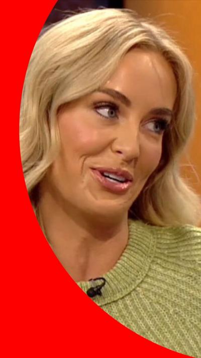 Leanne speaks on the BBC Breakfast sofa. She has wavy long blonde hair and a green woolly jumper 