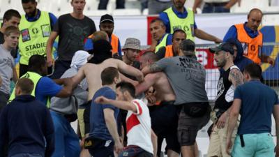 Groups of supporters clash at the end of the Euro 2016 group B football match between England and Russia at the Stade Velodrome