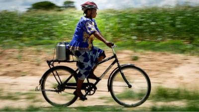 Woman on bike in Zambia