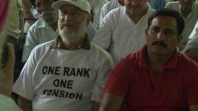 Retired Indian soldier wearing t-shirt with 'One Rank, One Pension' slogan