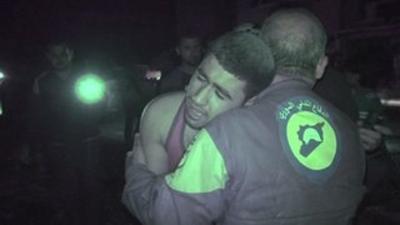 Distressed man being comforted by rescue worker