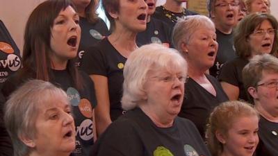 People signing in a choir