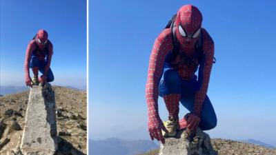 Dylan Hughes from Bangor dressed as Spider-Man atop Yr Wyddfa 