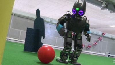 A robot playing football