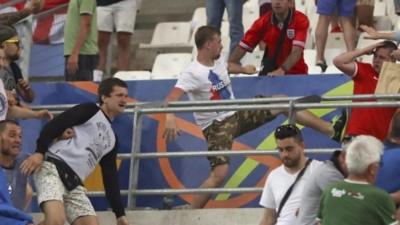 Man in Russia shirt kicks another man in Marseille stadium, 11 June 2016