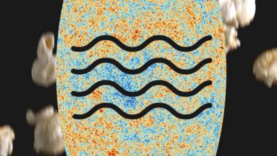 A curvy wave symbol on top of a radiation image in front of popping popcorn 