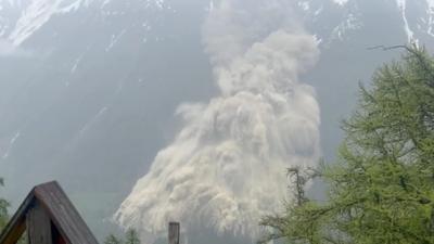 a cascade of ice and rubble crashes down the alps