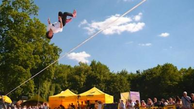 Slackliner doing a flip